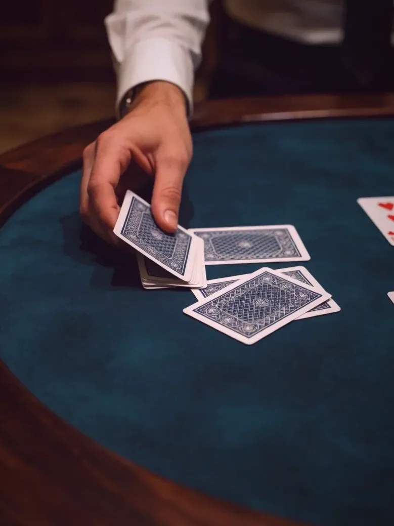 A hand being dealt under the wire